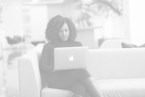 Woman on laptop shopping for homeowners insurance